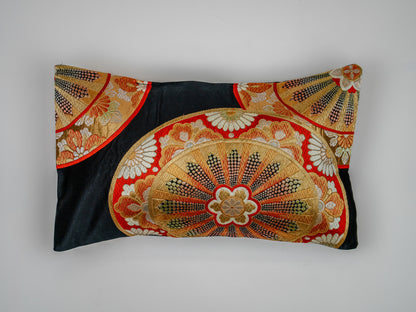 Japanese ceremonial silk lumbar pillow with genji-guruma carriage wheel in black and gold — Renaras atelier