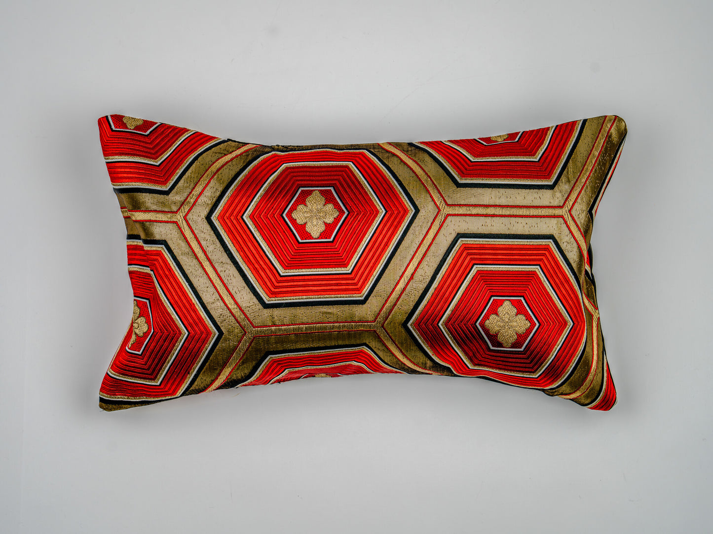 Japanese ceremonial silk lumbar pillow with kikkō hexagon in black, red and gold — Renaras atelier