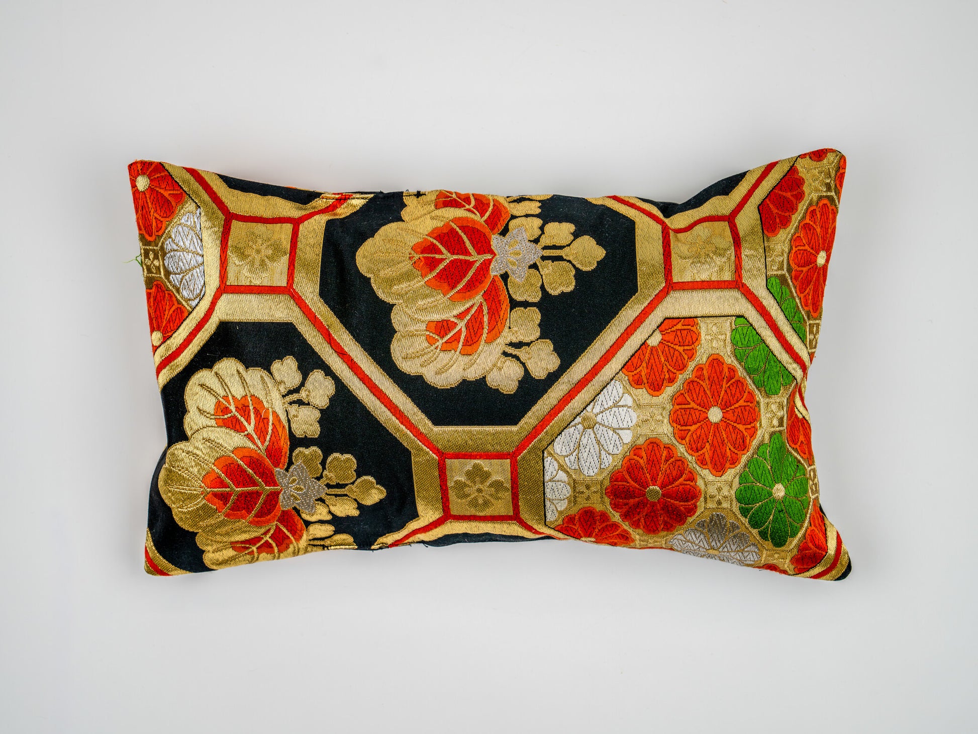 Japanese ceremonial silk lumbar pillow with kiri paulownia crest in black and gold — Renaras atelier