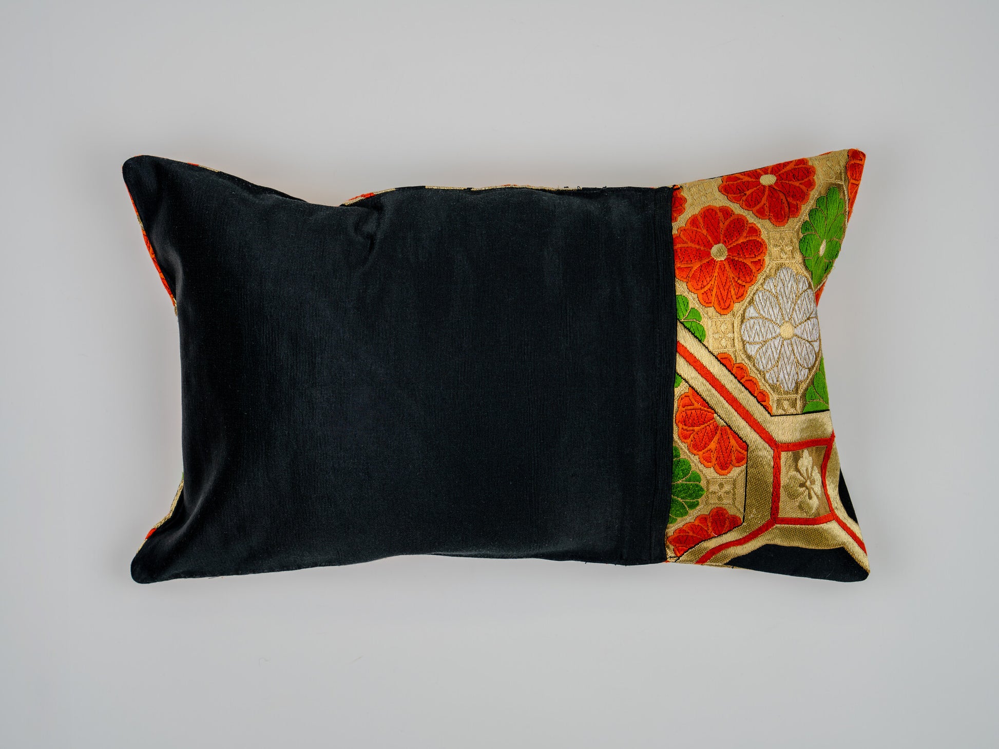 Japanese ceremonial silk lumbar pillow with kiri paulownia crest in black and gold — Renaras atelier