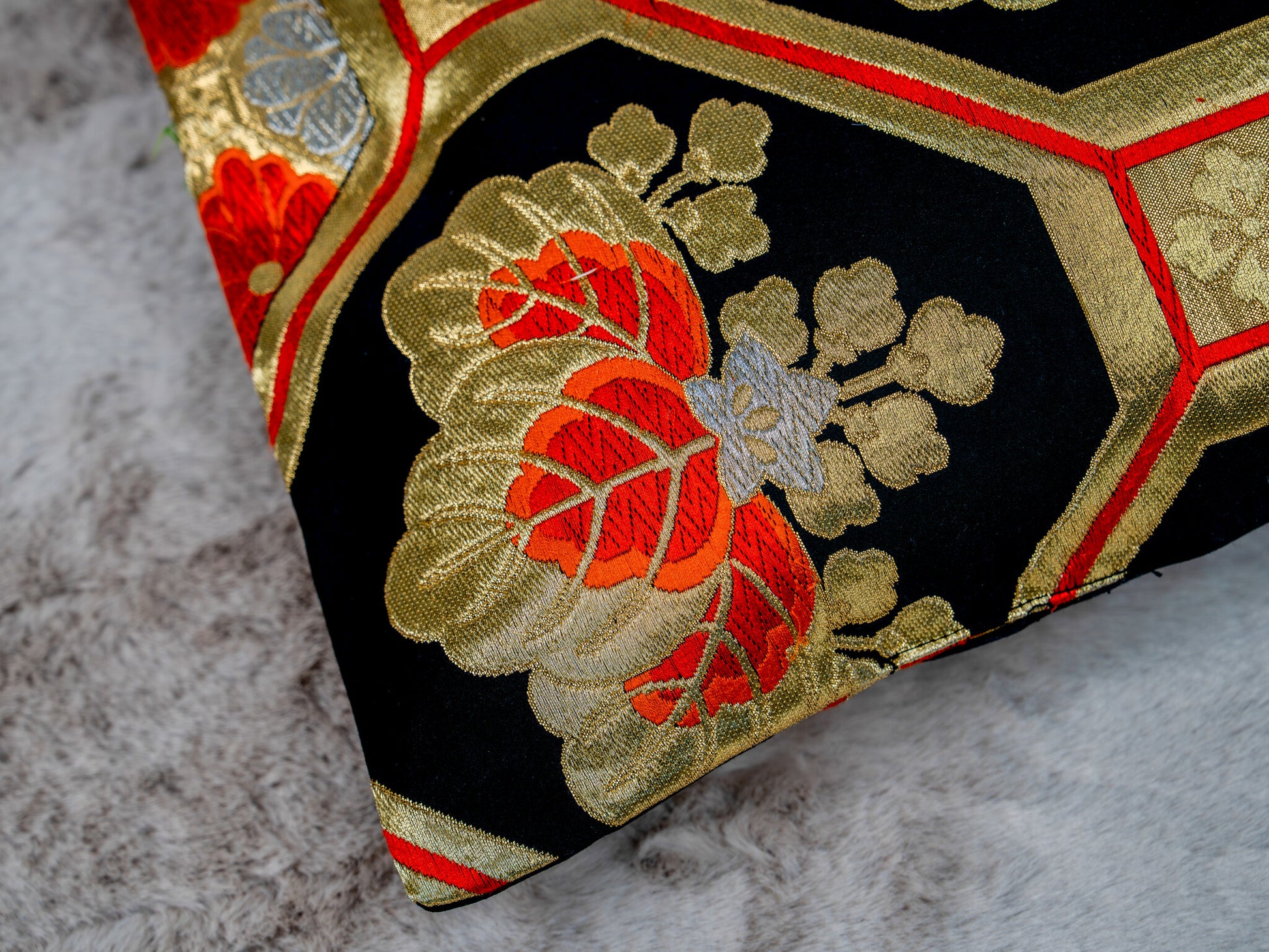 Japanese ceremonial silk lumbar pillow with kiri paulownia crest in black and gold — Renaras atelier