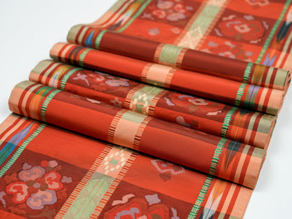 Japanese ceremonial silk table runner with Nagoya mosaic and ikat borders in terracotta and saffron — Renaras atelier