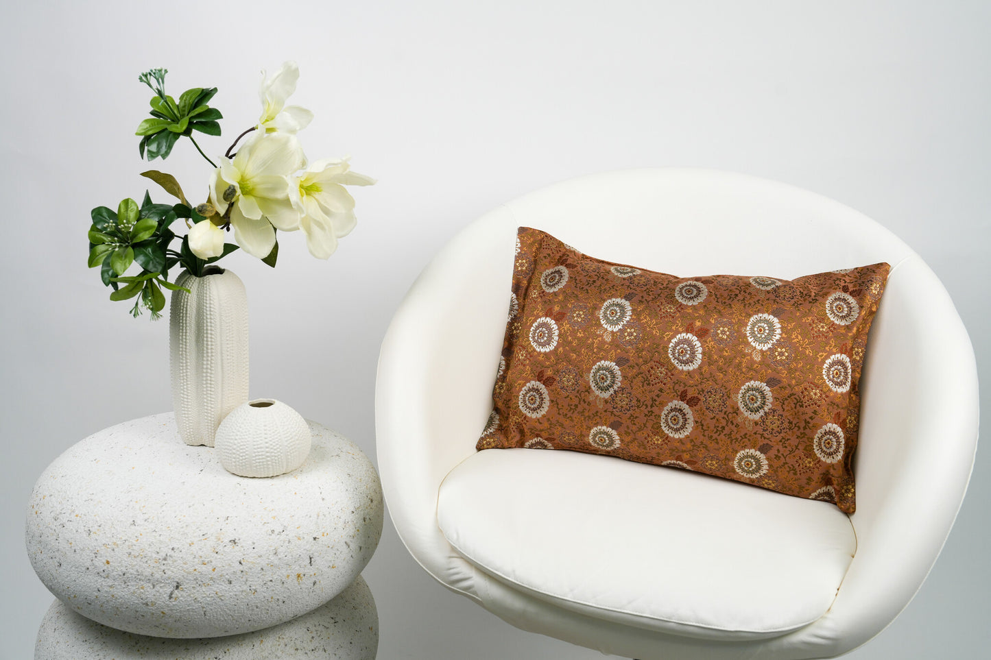 Japanese ceremonial silk lumbar pillow with kiku chrysanthemum in copper and pearl — Renaras atelier