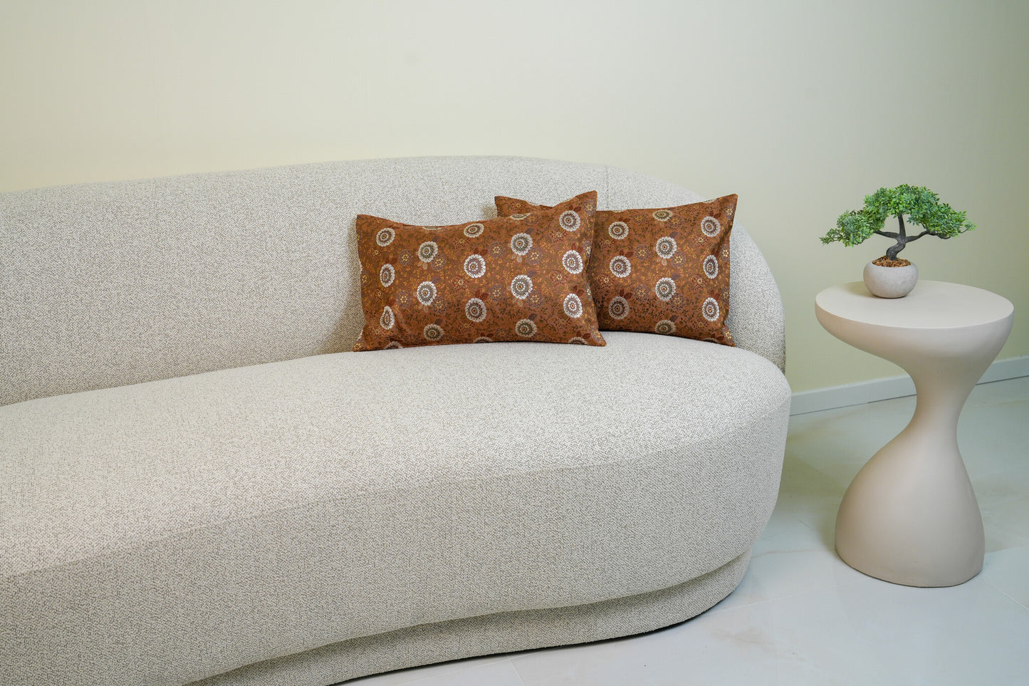 Japanese ceremonial silk lumbar pillow with kiku chrysanthemum in copper and pearl — Renaras atelier