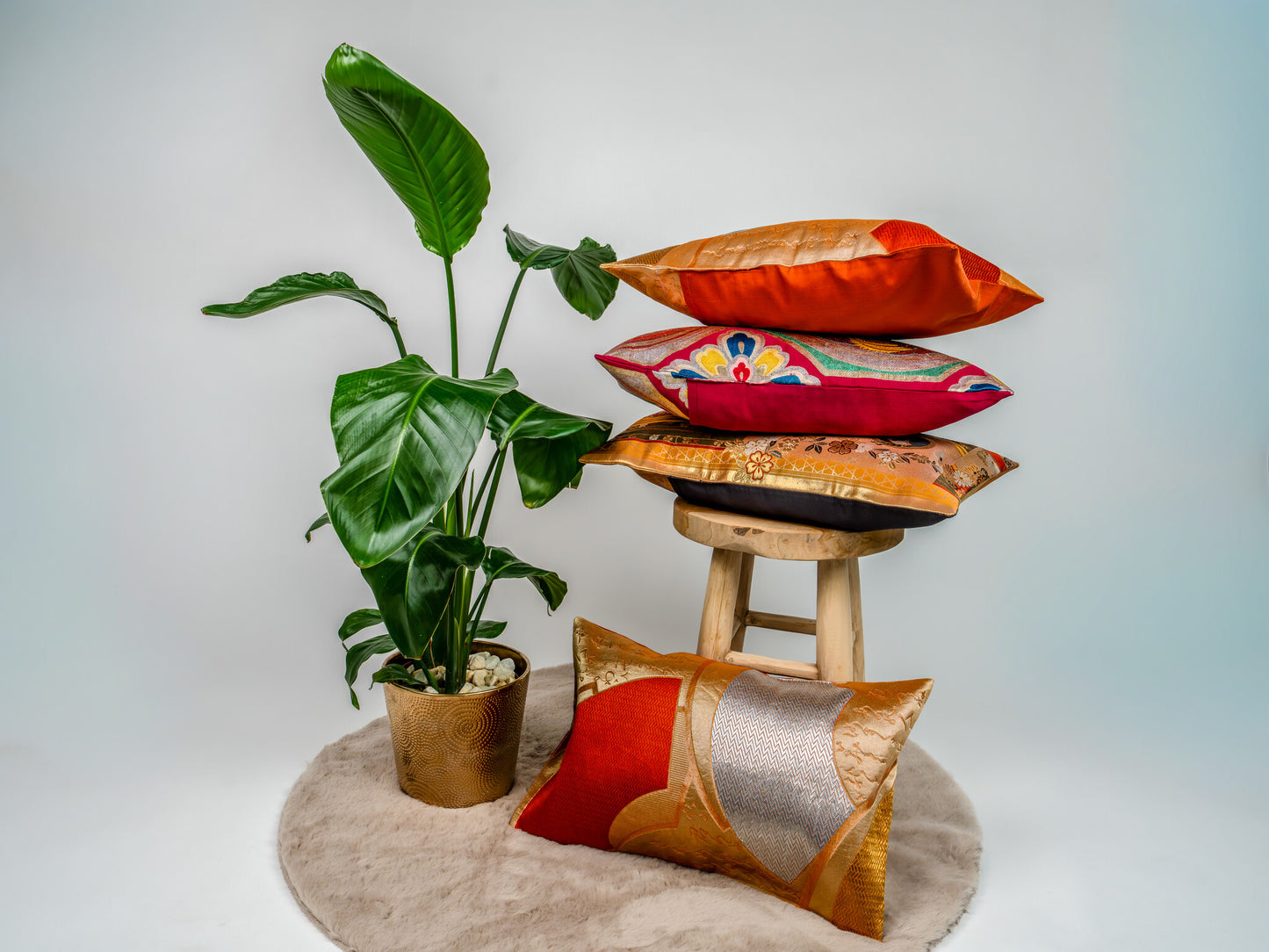 Japanese ceremonial silk lumbar pillow with herringbone chevron in persimmon and silver — Renaras atelier