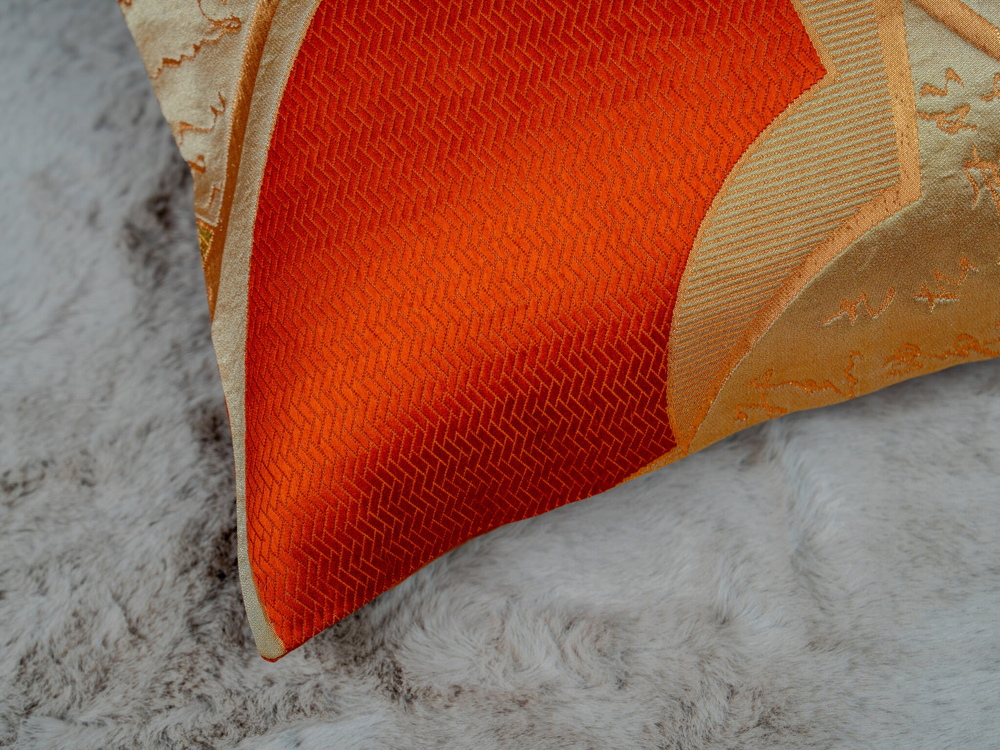 Japanese ceremonial silk lumbar pillow with herringbone chevron in persimmon and silver — Renaras atelier