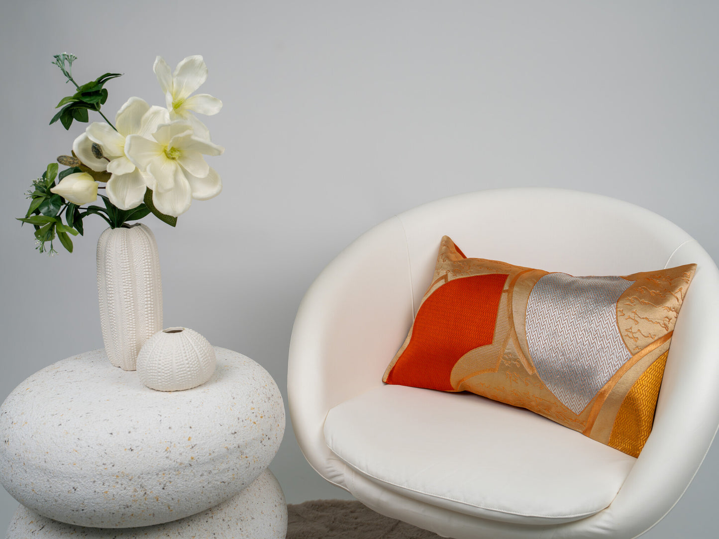 Japanese ceremonial silk lumbar pillow with herringbone chevron in persimmon and silver — Renaras atelier