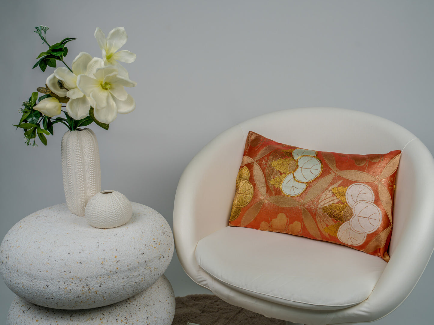Japanese ceremonial silk lumbar pillow with aoi crest in persimmon and gold — Renaras atelier
