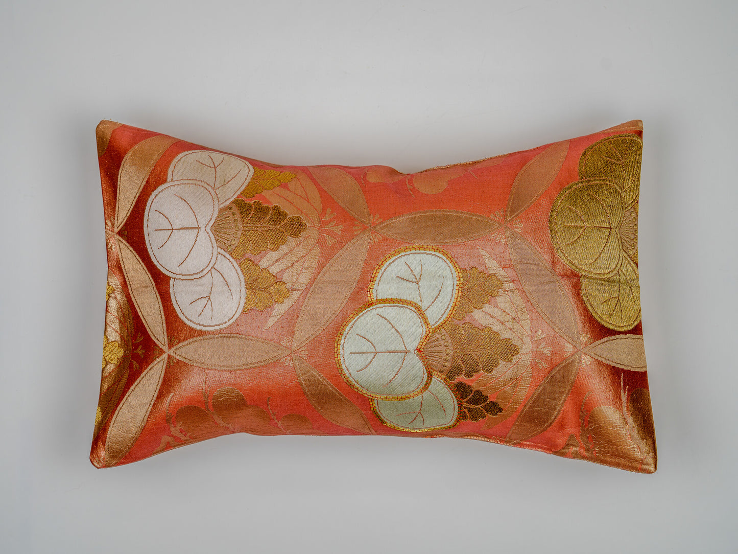 Japanese ceremonial silk lumbar pillow with aoi crest in persimmon and gold — Renaras atelier