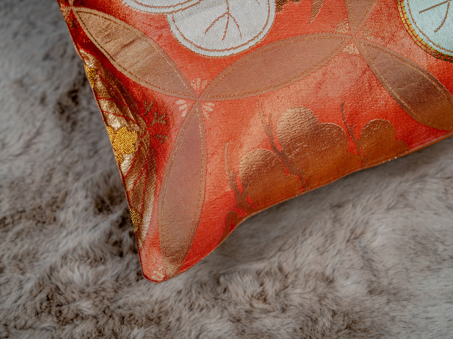 Japanese ceremonial silk lumbar pillow with aoi crest in persimmon and gold — Renaras atelier