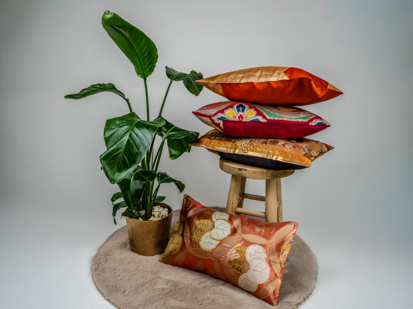 Japanese ceremonial silk lumbar pillow with aoi crest in persimmon and gold — Renaras atelier