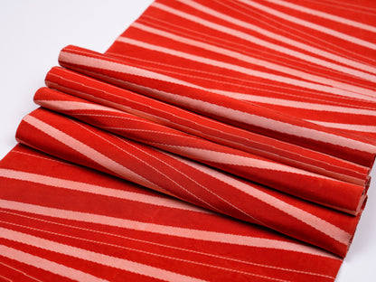 Japanese ceremonial silk table runner with radiating silver geometry on red ground — Renaras atelier
