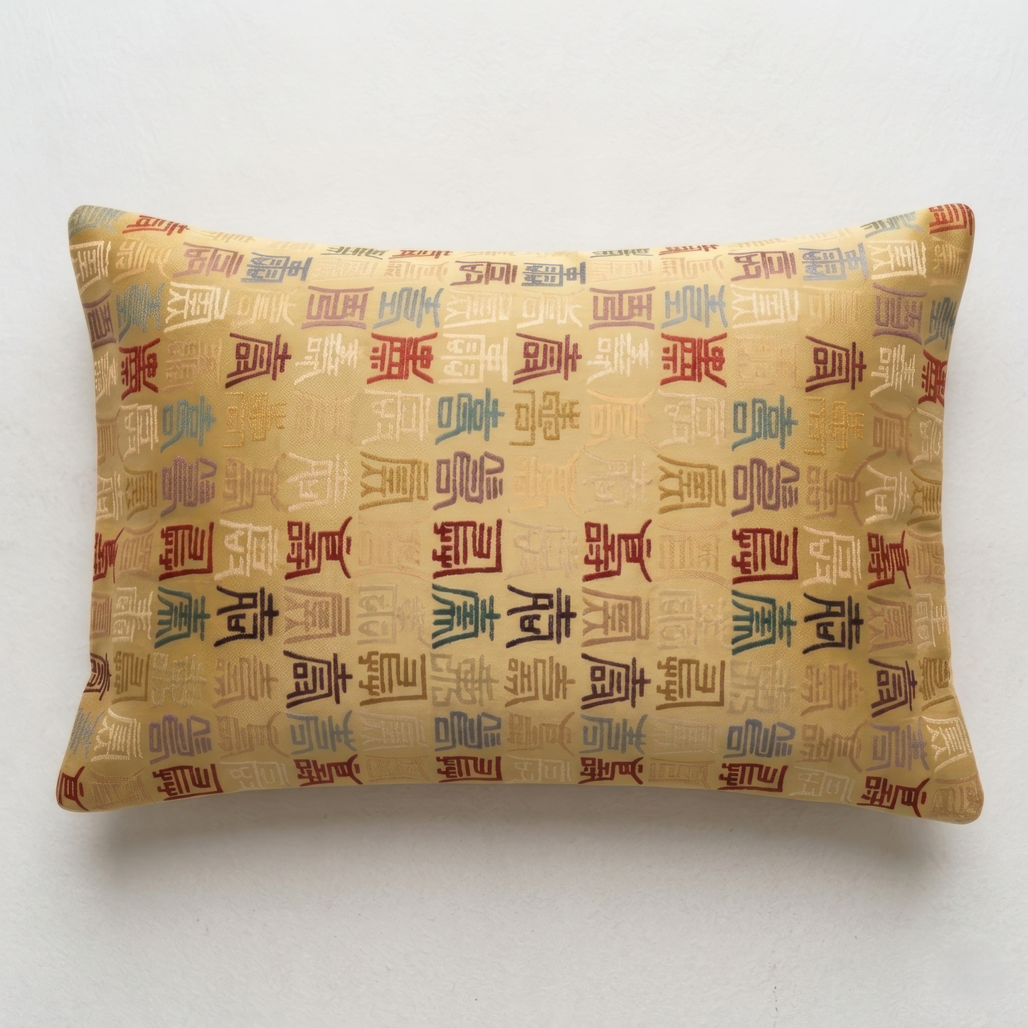 Japanese ceremonial silk lumbar pillow with tenshō seal script in gold and multicolour — Renaras atelier